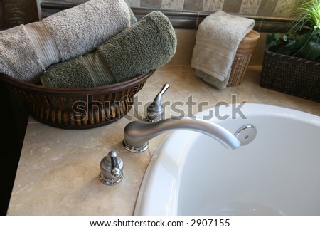 A bathtub in the bathroom of a upscale home interior
