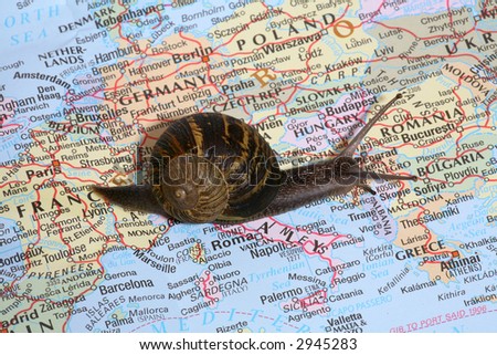 A snail crawling over a map, conceptually traveling through Europe