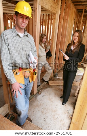 Two real estate agents interacting with the construction man builder