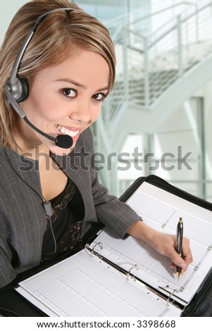 A pretty customer service woman taking notes