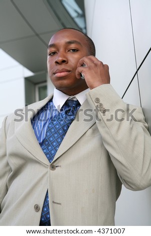 A handsome business sales man making a call for a sale