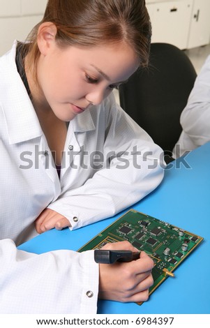 Women technician working on computer parts in the lab