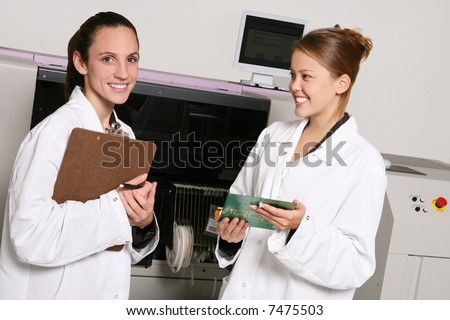 Women computer technicians working on computer parts in the lab