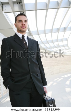 A young, handsome business man on his way to work