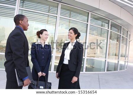 An attractive team of diverse business people at company office building