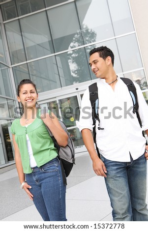 Attractive students at college walking on campus