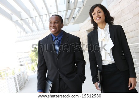 stock photo : An attractive, african american business team meeting as a group