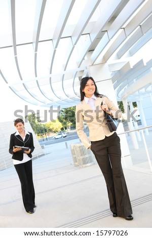 Pretty women walking to the office building to start work
