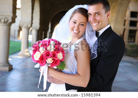 stock photo A beautiful bride and handsome groom at church during wedding