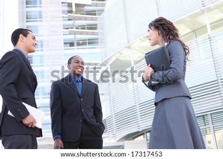 A diverse young man and woman business team at office building