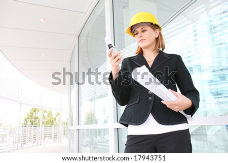 A pretty woman architect on the building construction site