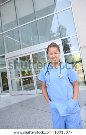 An attractive woman nurse outside hospital building