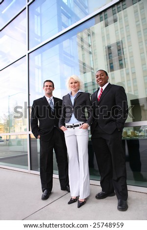 Attractive man and woman diverse business team at  office building