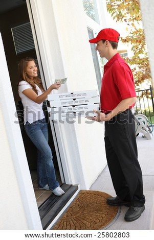 A  pizza delivery man giving order to pretty woman