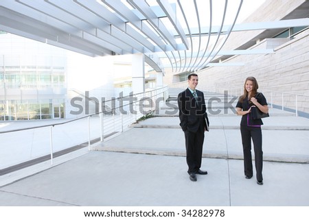 An attractive man and woman business team at the office