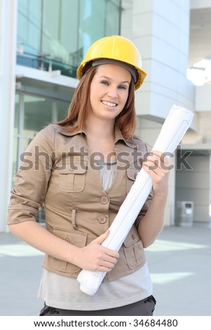 A pretty business woman architect on a building construction site