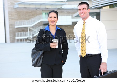 An attractive diverse man and woman business team at office