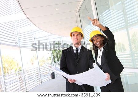 A young man and woman working on  construction site