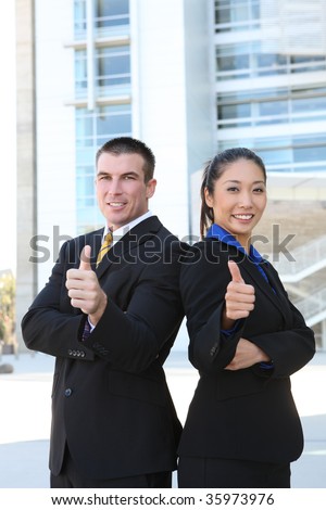 Successful happy business man and woman team celebrating