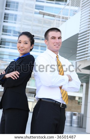 An attractive diverse man and woman business team at office