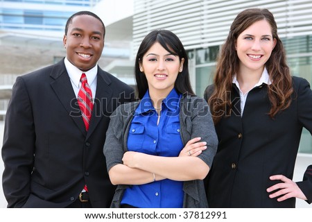 Attractive diverse business man and women team at office building
