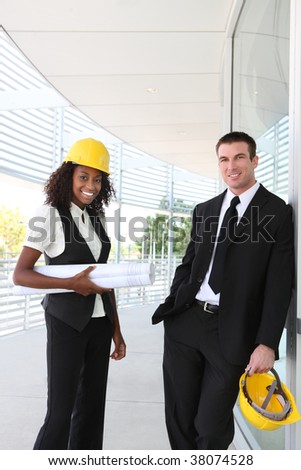 A diverse man and woman working as architect on a construction site