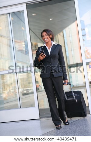 An attractive african american business woman traveling