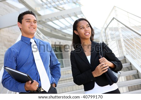 stock photo : A diverse man and woman business team at their company office building