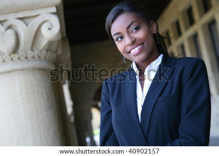 A young and pretty african american woman at college