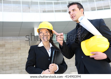 A man and woman architect team on  construction site