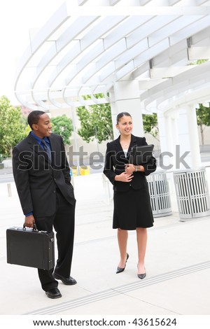 A diverse business man and woman team at office building