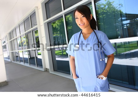 A cute young asian nurse outside the hospital