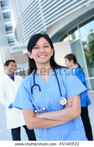 A happy and successful medical man and woman team outside hospital building