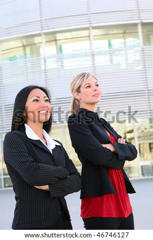 A diverse business woman team outside office building