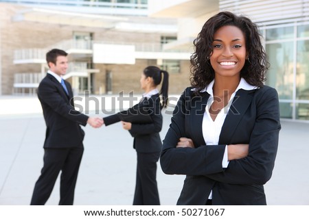A diverse attractive man and woman business team at office building