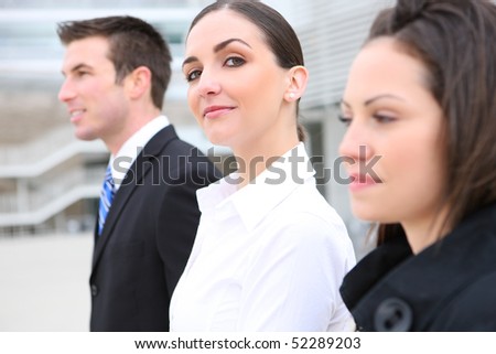 An attractive business man and woman team at office building