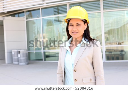 A young pretty woman architect on building construction site
