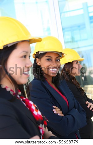 An attractive diverse woman architect team on construction site