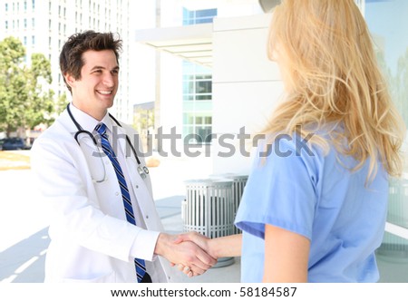 A man and woman medical team handshake outside hospital