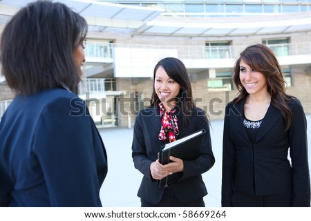 A diverse attractive woman business team at office building