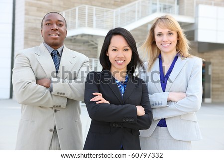 A man and woman business team at office representing diversity (Focus on middle woman)