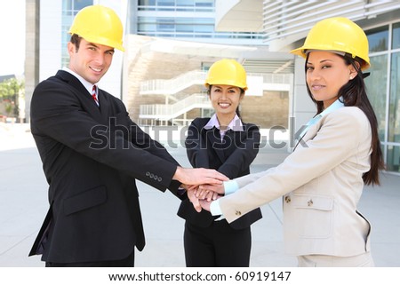 A  business construction man and woman team handshake at work site