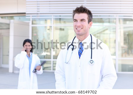 An handsome doctor with woman coworker nurse in background