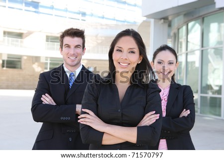 A diverse attractive man and woman business team at office building