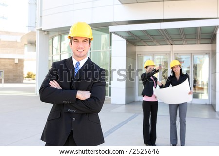 A business man and woman construction team at office building