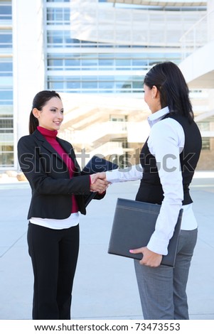 A  young women business team at the office handshake