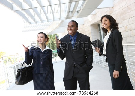 Diverse attractive business man and woman team at office building