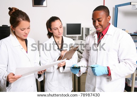 Young diverse and attractive man and woman team in computer lab