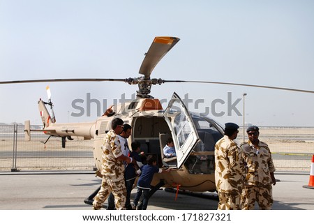 SAKHIR AIRBASE, BAHRAIN- JANUARY 17: Static display of Bell 105 Helicopter in the public area during Bahrain International Airshow at Sakhir Airbase, Bahrain on 17 January, 2014