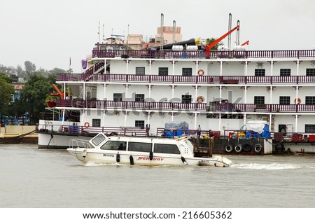 GOA, INDIA- AUGUST 10: A speed boat approaching near the Casino Pride of Goa on August 10, 2014 in the Mandovi river Goa